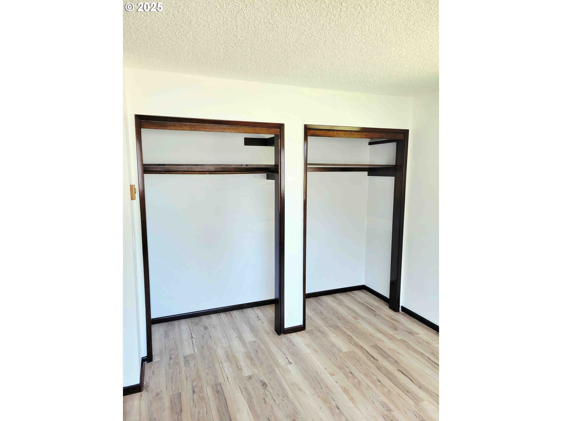 300 Maple Street Toledo, WA 98591 - Photo 10 of 19 a view of an empty room with wooden floor
