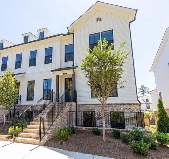 209 Phillips Lane Alpharetta, GA 30009 - Photo 1 of 48 a front view of a building