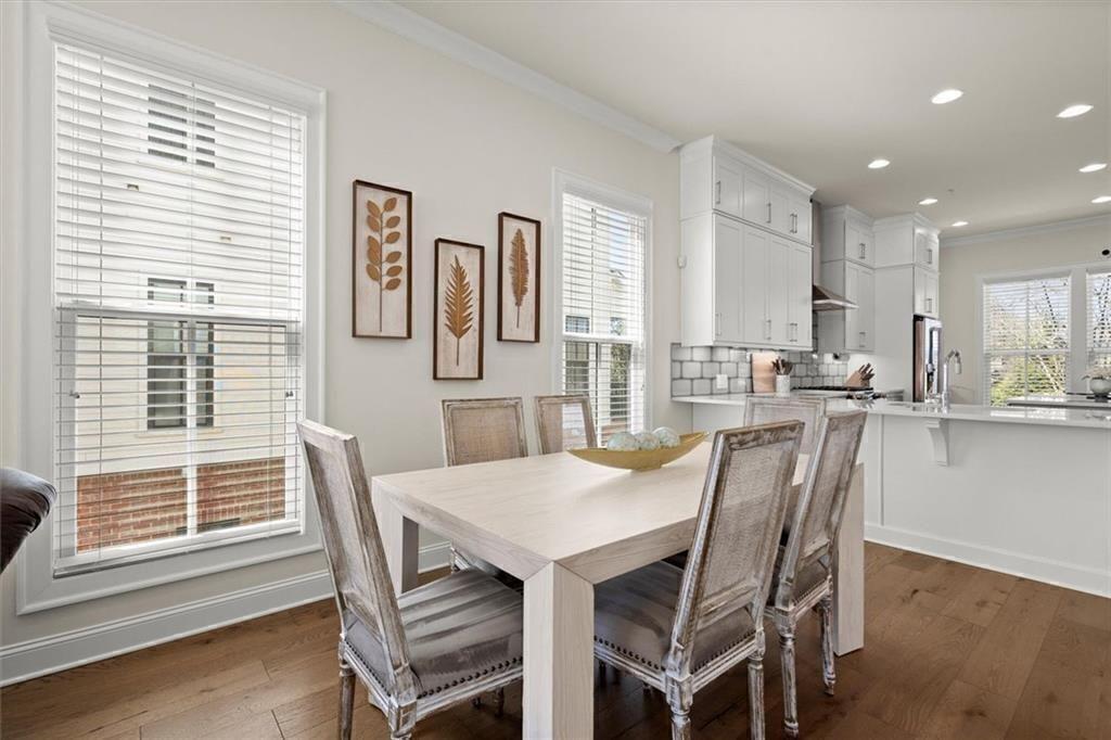209 Phillips Lane Alpharetta, GA 30009 - Photo 11 of 48 a view of a dining room with furniture and windows