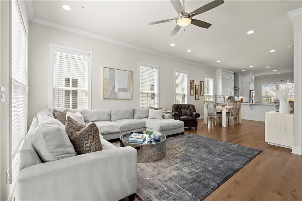 209 Phillips Lane Alpharetta, GA 30009 - Photo 14 of 48 a living room with furniture wooden floor and a table