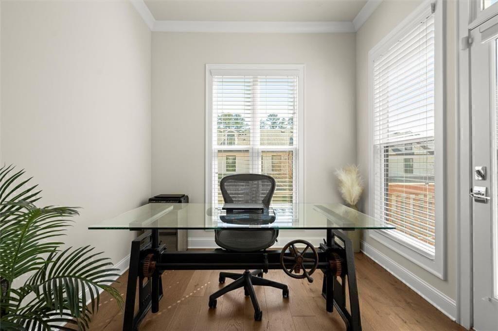 209 Phillips Lane Alpharetta, GA 30009 - Photo 15 of 48 a view of a workspace with furniture and a window