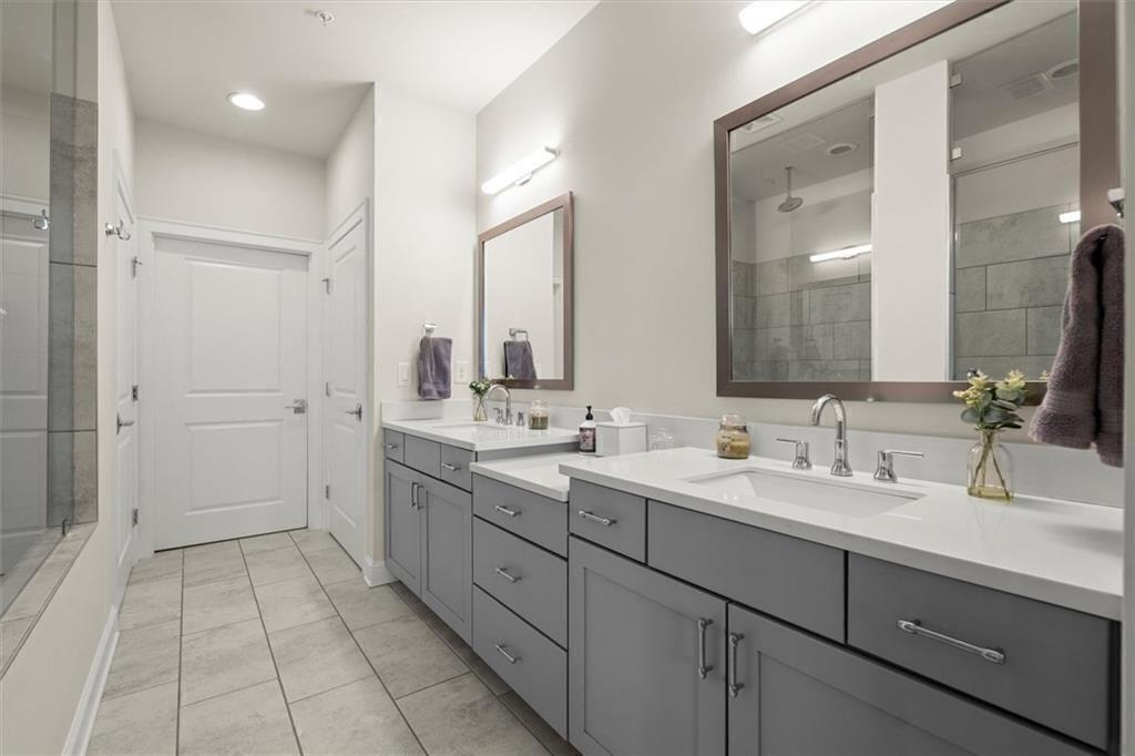 209 Phillips Lane Alpharetta, GA 30009 - Photo 22 of 48 a bathroom with a double vanity sink mirror and