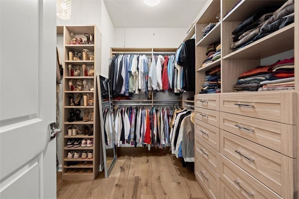 209 Phillips Lane Alpharetta, GA 30009 - Photo 24 of 48 a view of walk in closet with clothes and shoes