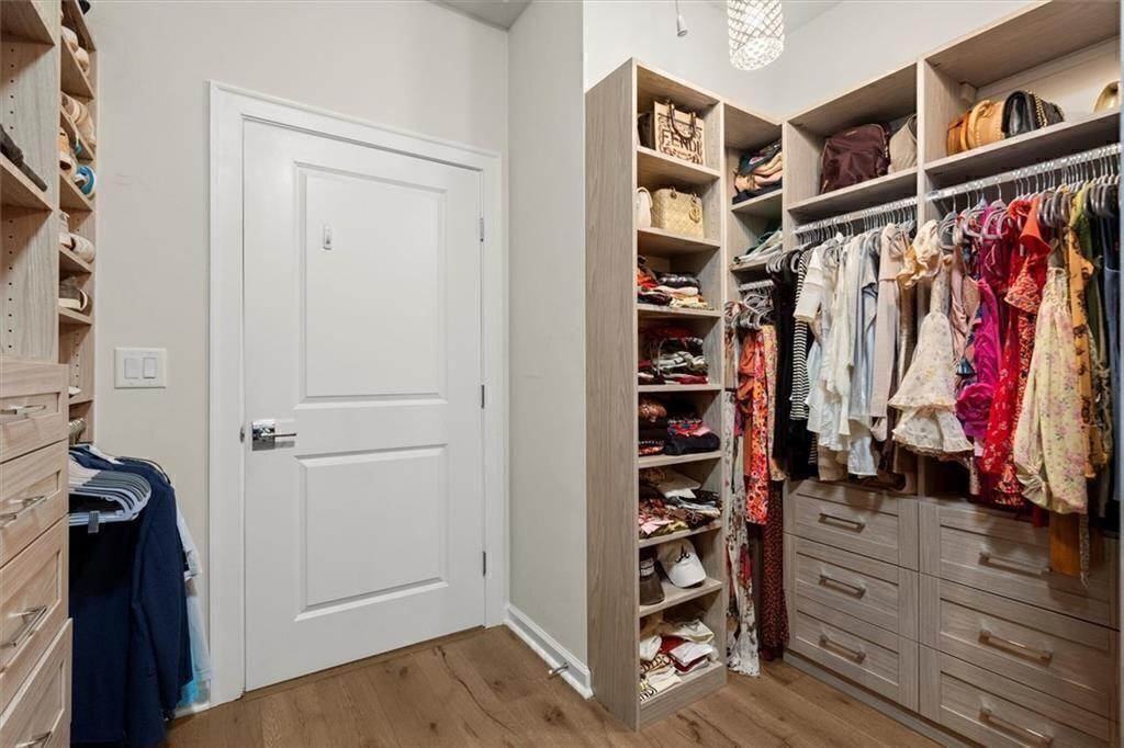 209 Phillips Lane Alpharetta, GA 30009 - Photo 25 of 48 a view of walk in closet with clothes and shoes