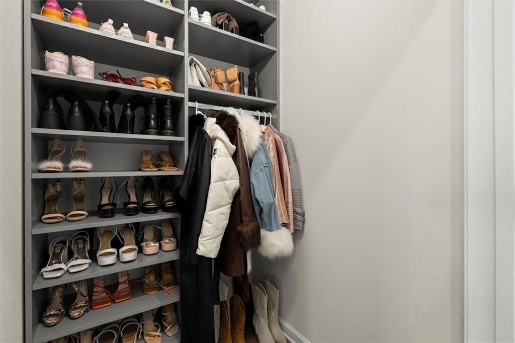 209 Phillips Lane Alpharetta, GA 30009 - Photo 26 of 48 a view of walk in closet with clothes and shoes