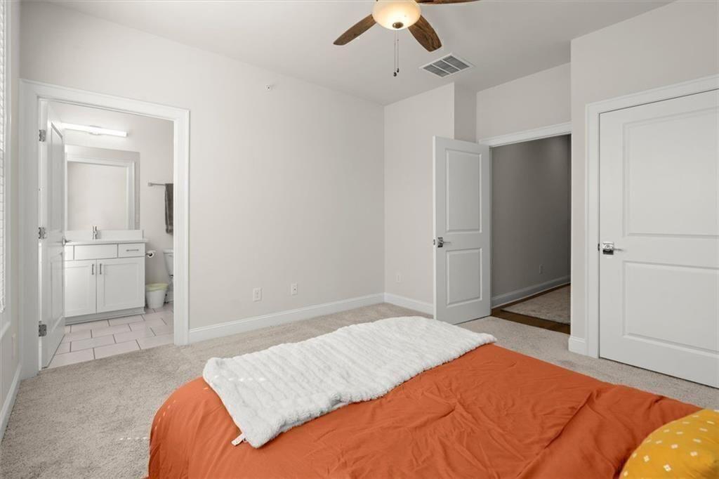 209 Phillips Lane Alpharetta, GA 30009 - Photo 27 of 48 a bedroom with a bed and a view of bathroom
