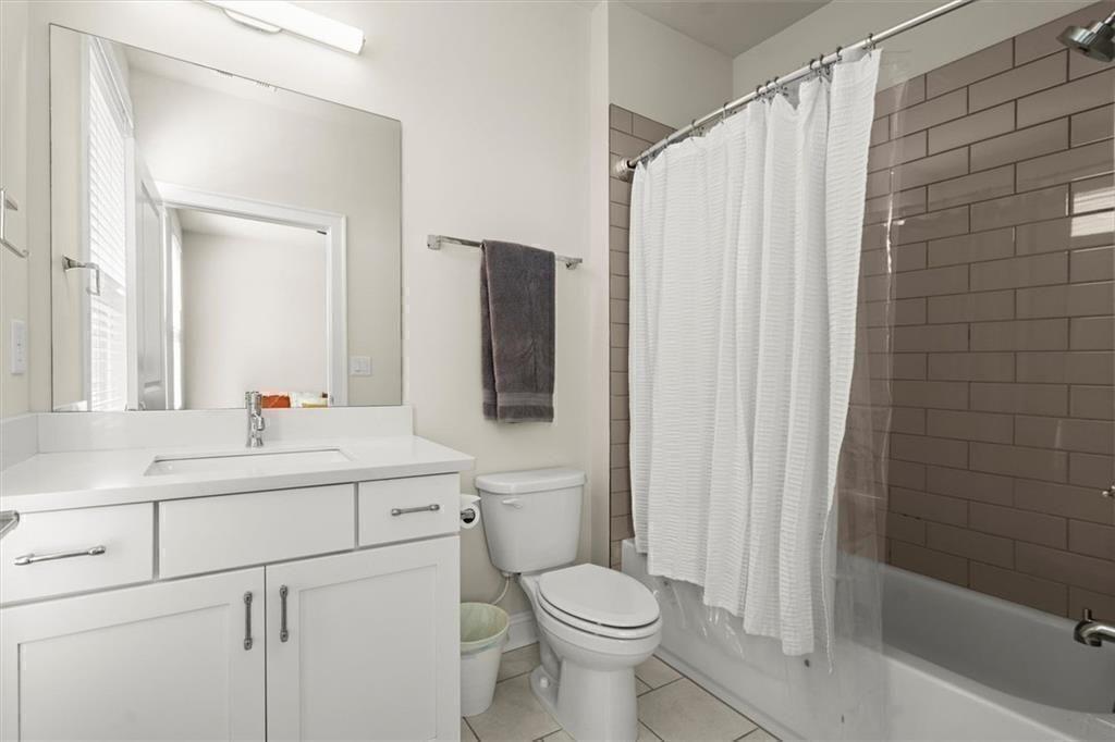 209 Phillips Lane Alpharetta, GA 30009 - Photo 28 of 48 a bathroom with a sink toilet and shower