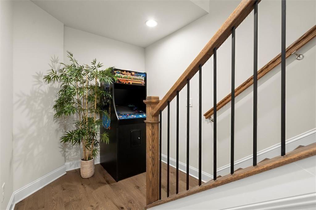 209 Phillips Lane Alpharetta, GA 30009 - Photo 29 of 48 a view of entryway with wooden floor and stairs