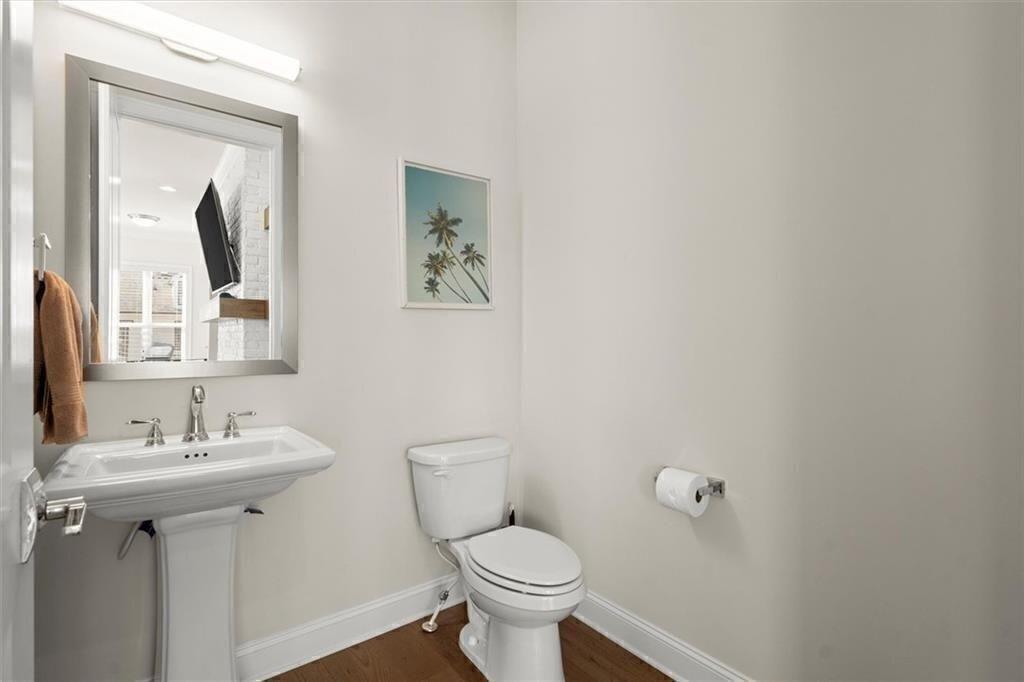 209 Phillips Lane Alpharetta, GA 30009 - Photo 41 of 48 a bathroom with a toilet sink and mirror