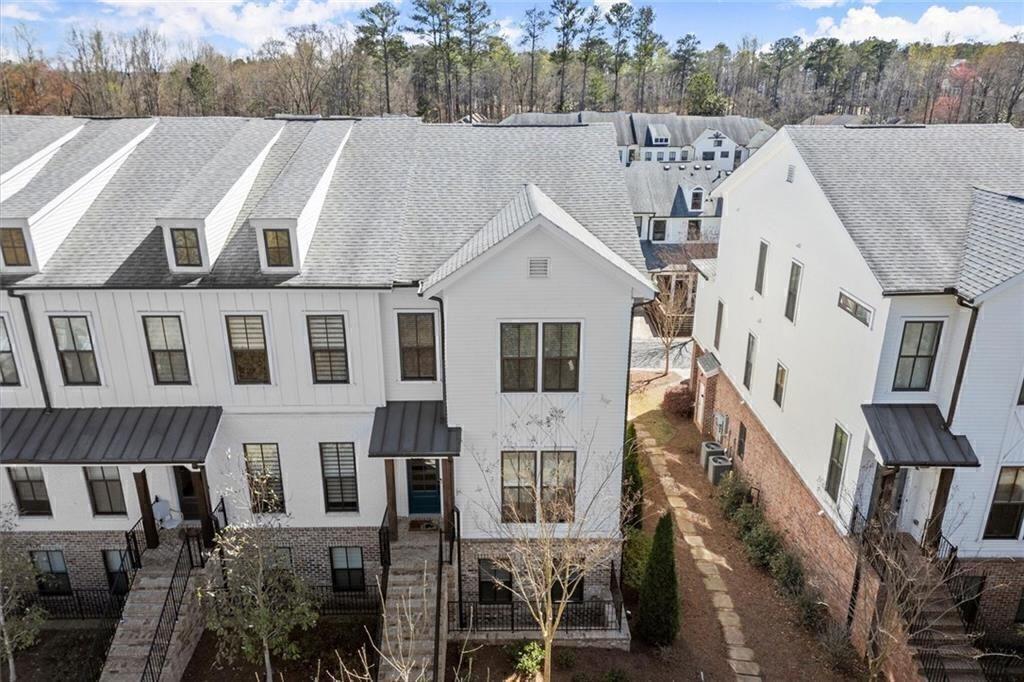 209 Phillips Lane Alpharetta, GA 30009 - Photo 46 of 48 a view of a big house with a yard in front of it