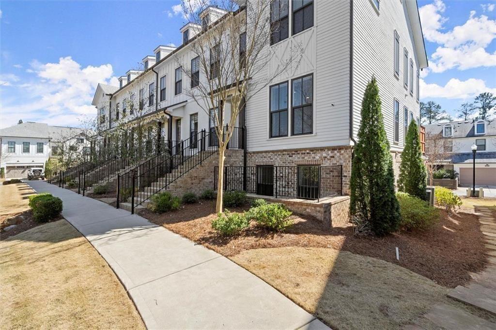 209 Phillips Lane Alpharetta, GA 30009 - Photo 48 of 48 a view of a building with a yard