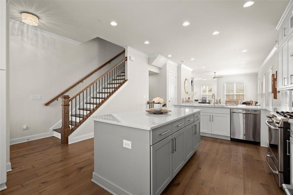 209 Phillips Lane Alpharetta, GA 30009 - Photo 6 of 48 a kitchen with white cabinets appliances and a sink