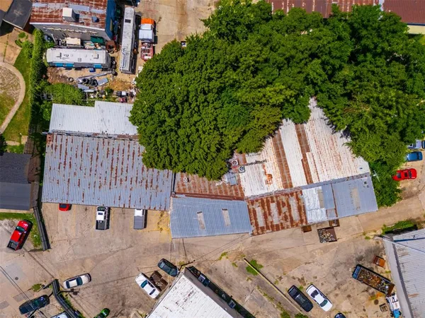 an aerial view of a house with pool patio and outdoor seating