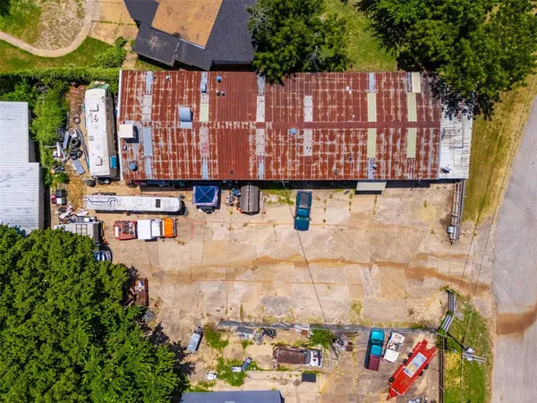 a view of swimming pool with outdoor seating and a garden