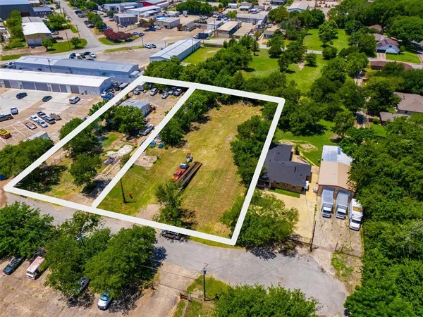 an aerial view of house with a yard