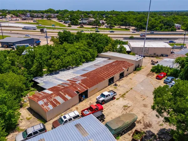 an aerial view of a houses with yard