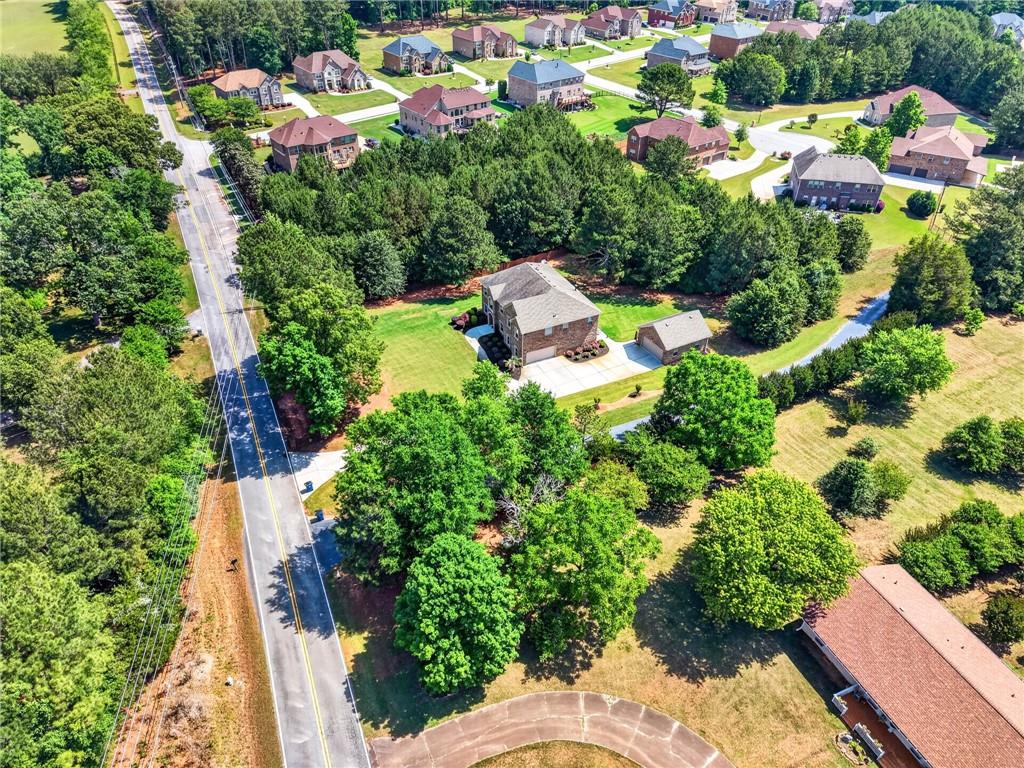 2300 Tucker Mill Road Southwest Conyers, GA 30094 - Photo 2 of 45 an aerial view of a house with a yard and outdoor seating