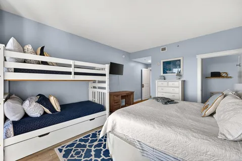 a bedroom with a bed and closet