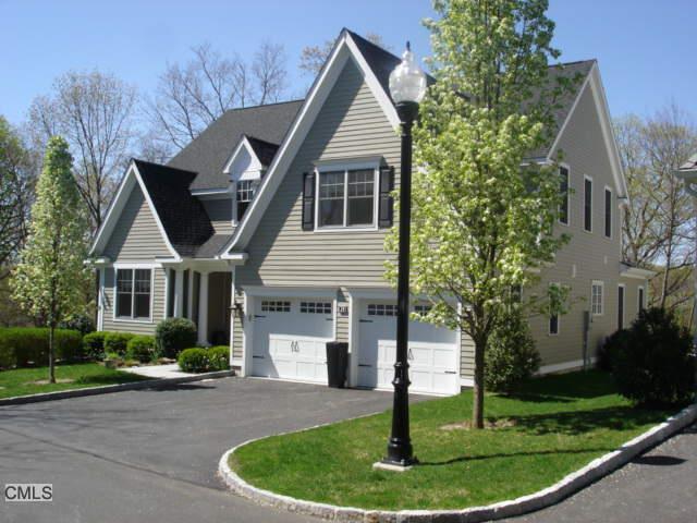 631 Long Ridge Road, Unit 29 Stamford, CT 06902 - Photo 1 of 1 a front view of a house with a yard