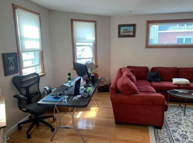 24 P Street, Unit 2 Boston, MA 02127 - Photo 7 of 10 a living room with furniture and a window