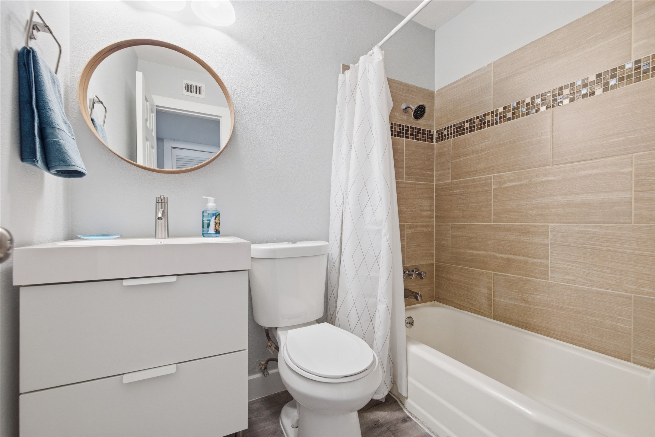 2401 Manor Road, Unit 232 Austin, TX 78722 - Photo 11 of 32 a bathroom with a sink toilet and shower