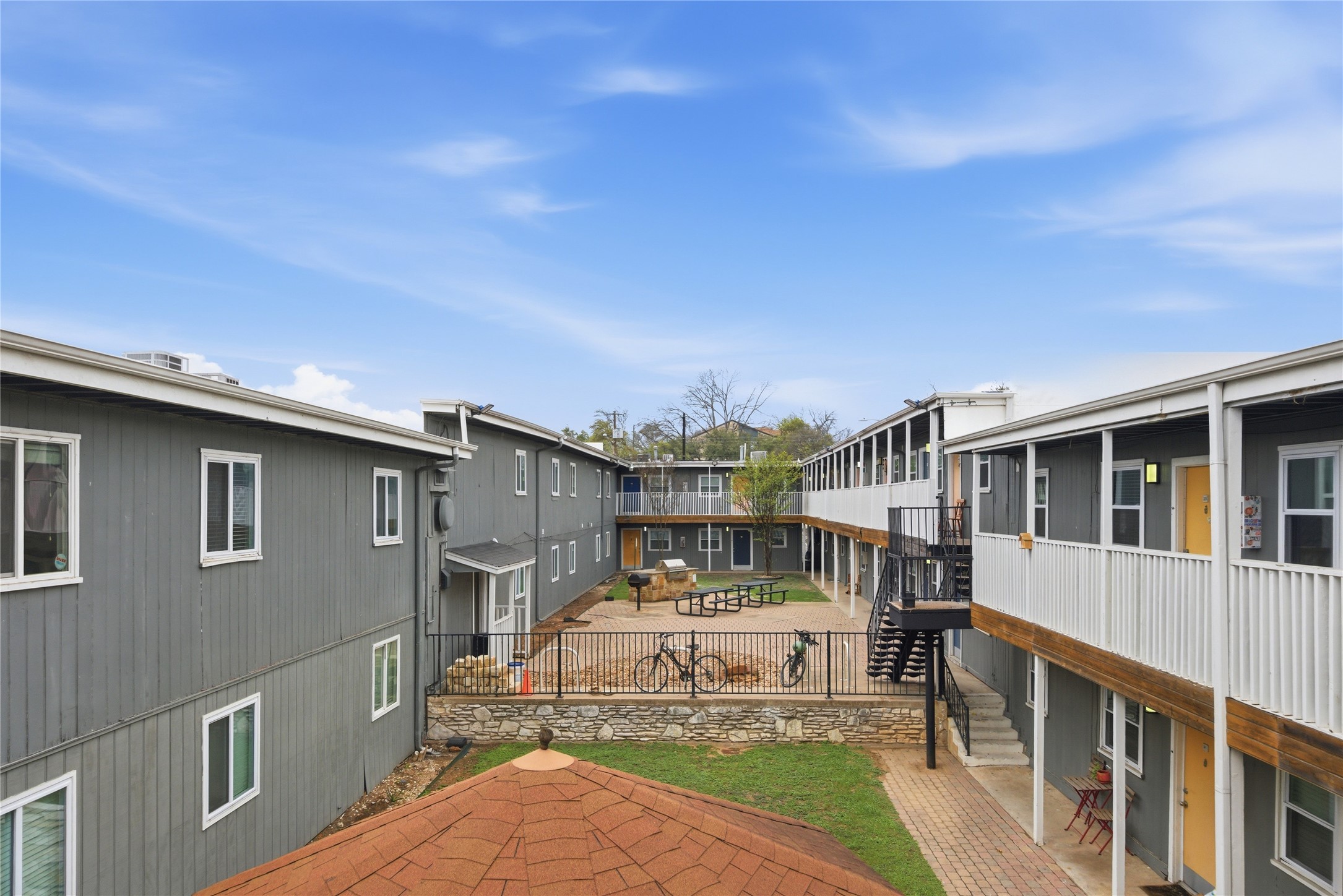 2401 Manor Road, Unit 232 Austin, TX 78722 - Photo 18 of 32 a front view of a house with a yard