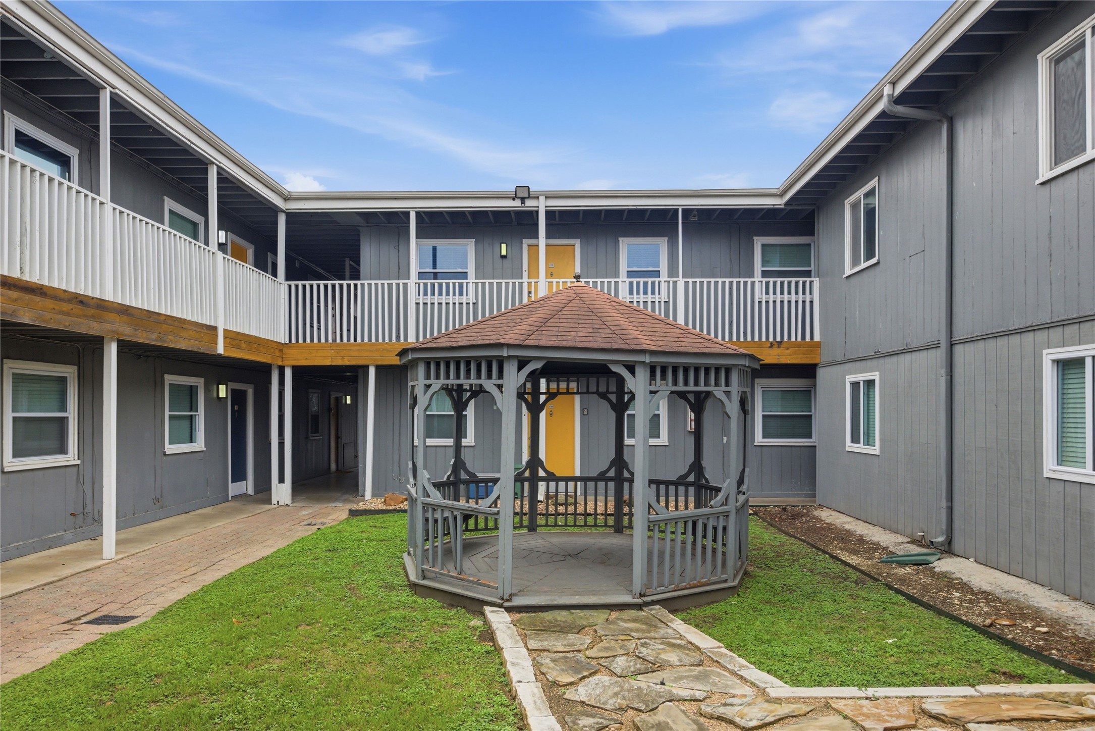 2401 Manor Road, Unit 232 Austin, TX 78722 - Photo 21 of 32 a view of a house with backyard porch and sitting area