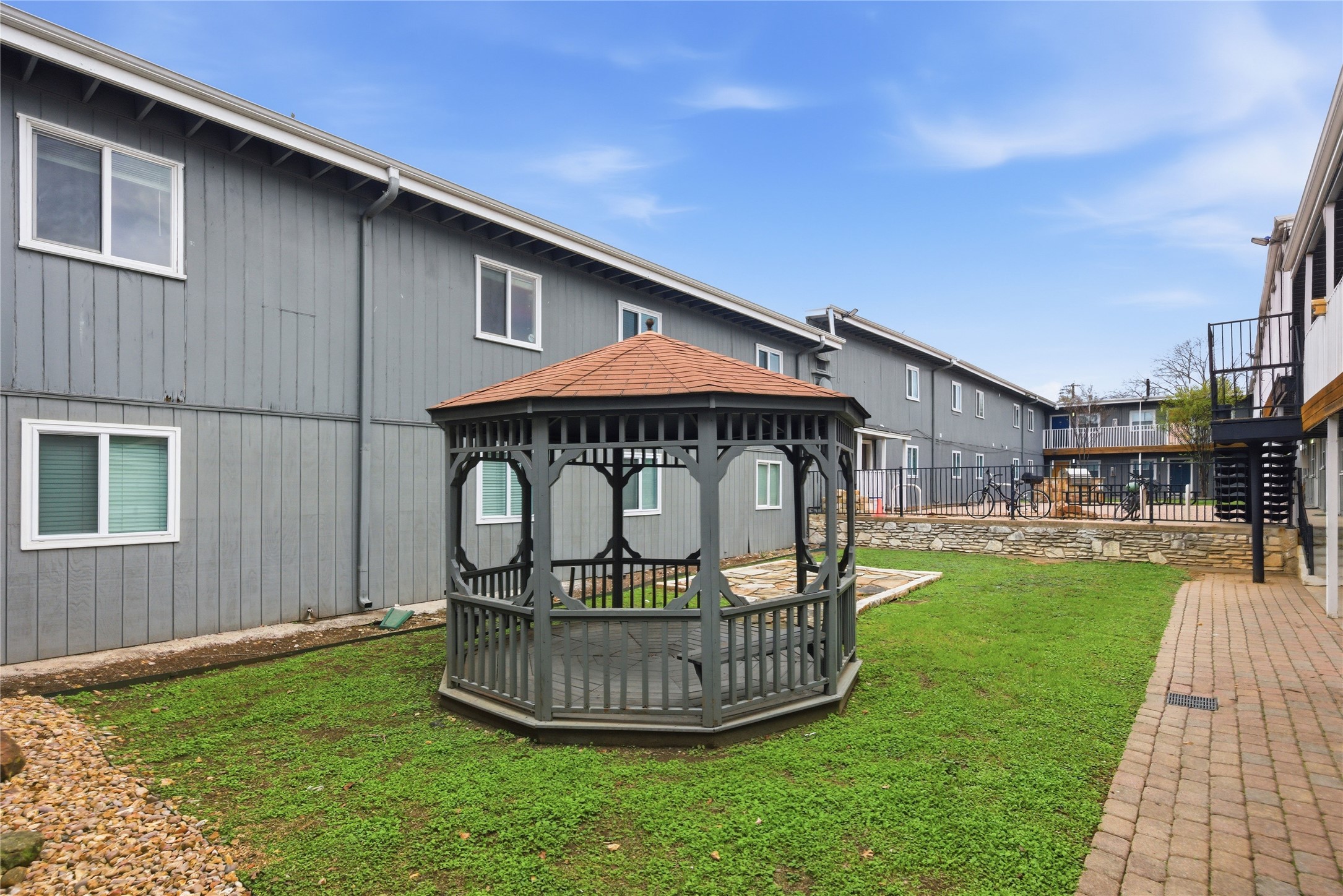 2401 Manor Road, Unit 232 Austin, TX 78722 - Photo 22 of 32 a front view of a house with garden