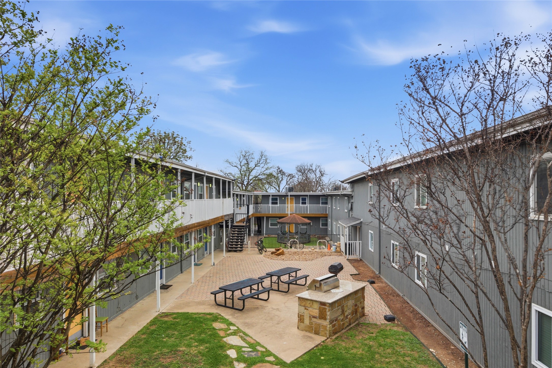 2401 Manor Road, Unit 232 Austin, TX 78722 - Photo 23 of 32 a view of a house with roof deck front of house
