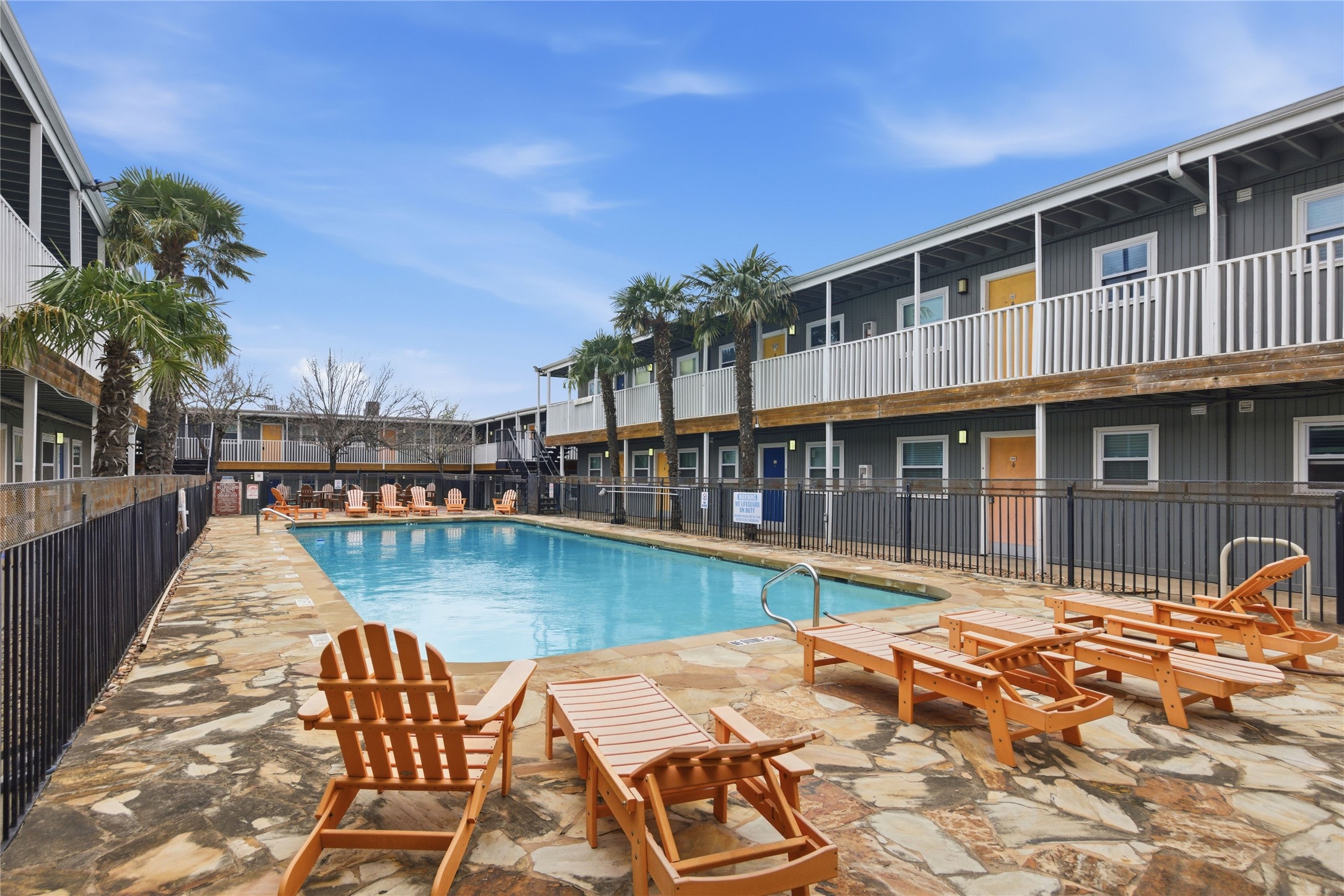 2401 Manor Road, Unit 232 Austin, TX 78722 - Photo 24 of 32 a front view of a house with swimming pool