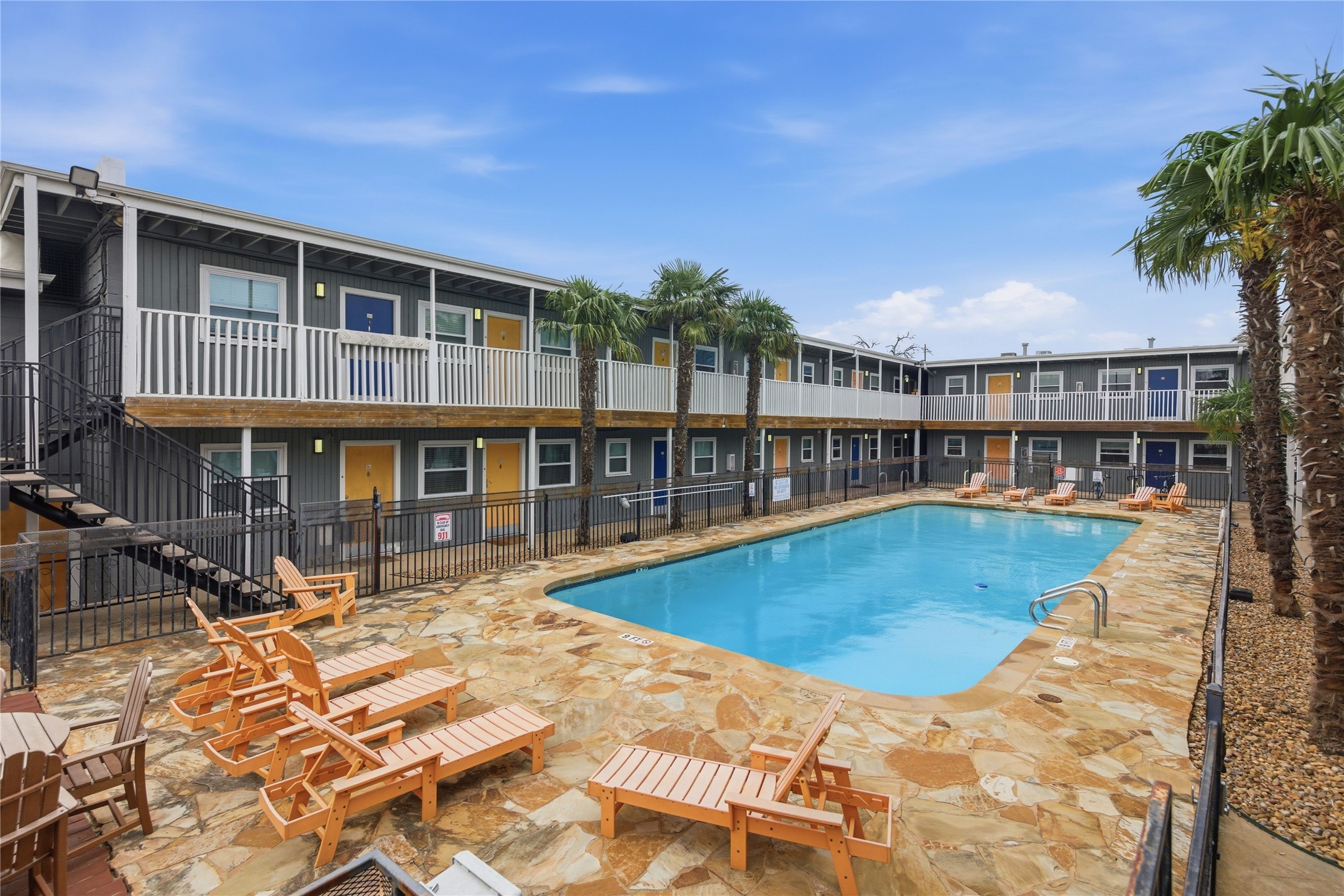 2401 Manor Road, Unit 232 Austin, TX 78722 - Photo 25 of 32 a view of a swimming pool with outdoor seating