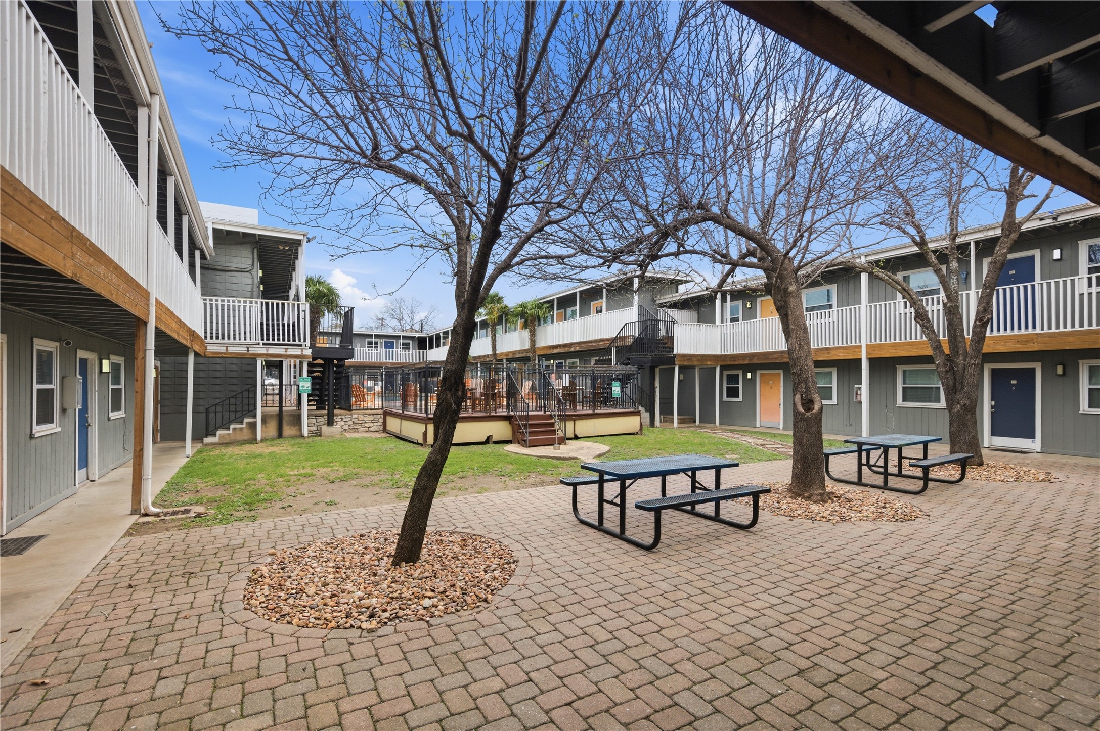 2401 Manor Road, Unit 232 Austin, TX 78722 - Photo 27 of 32 a house with pool table and chairs