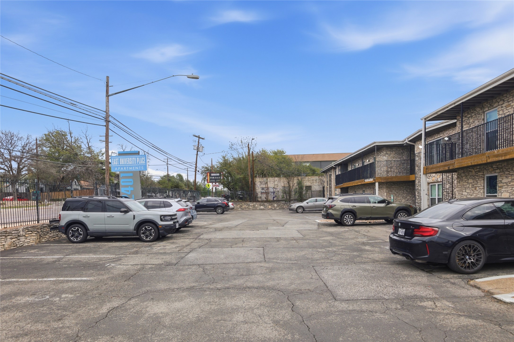 2401 Manor Road, Unit 232 Austin, TX 78722 - Photo 29 of 32 a view of a cars parked in front of a house