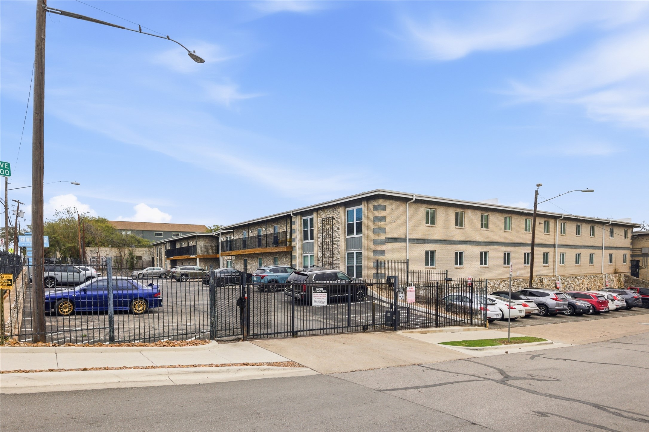 2401 Manor Road, Unit 232 Austin, TX 78722 - Photo 31 of 32 a large building with swimming pool in front of it