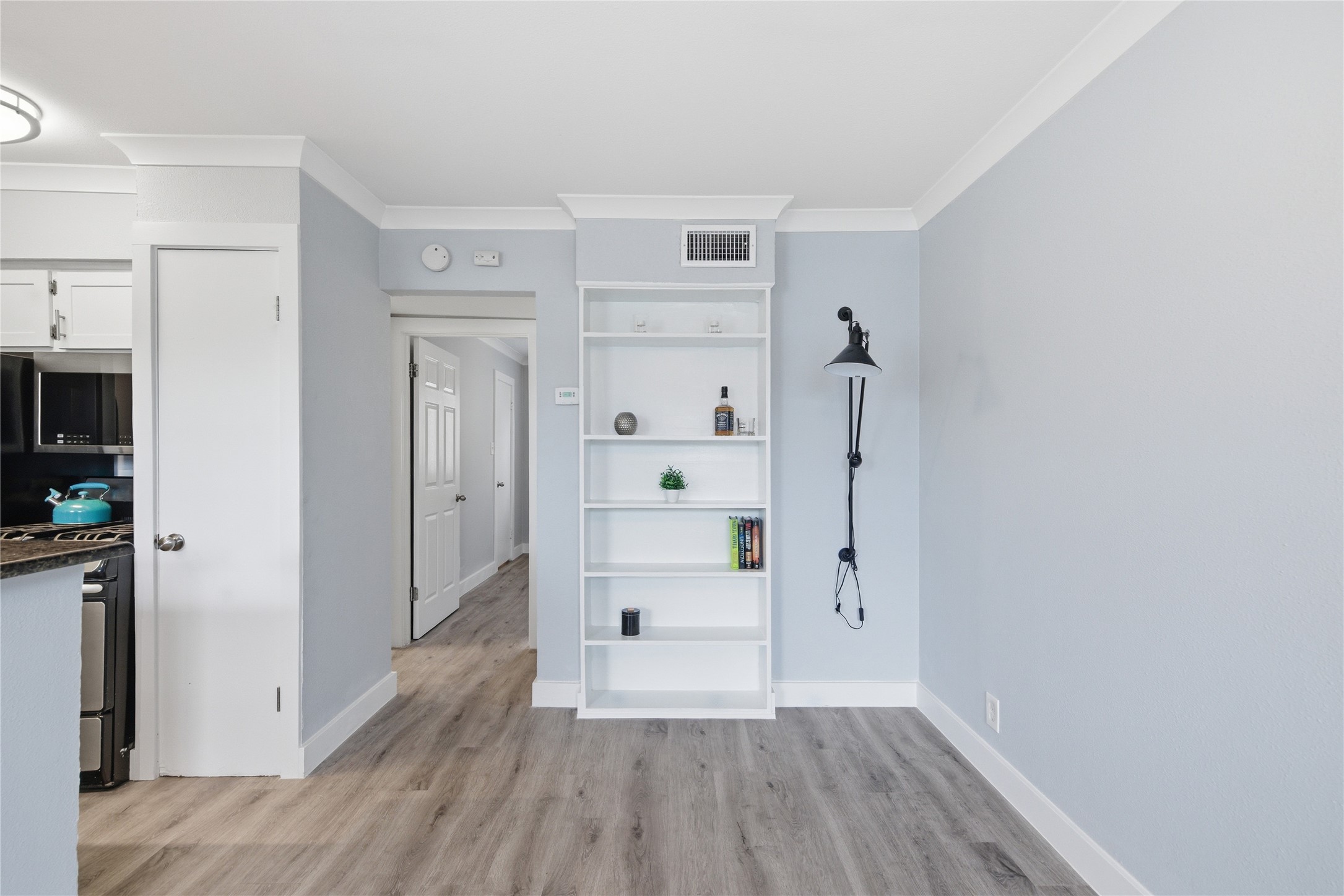 2401 Manor Road, Unit 232 Austin, TX 78722 - Photo 9 of 32 a view of empty room with wooden floor