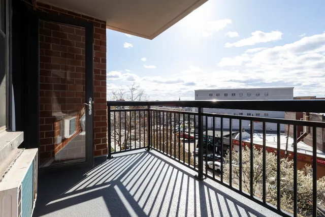 a view of balcony with wooden floor
