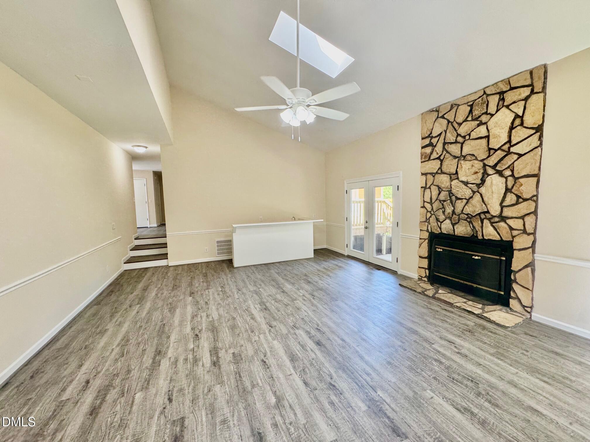 1720 Ross Mill Road Henderson, NC 27537 - Photo 12 of 42 wooden floor in an empty room with a window