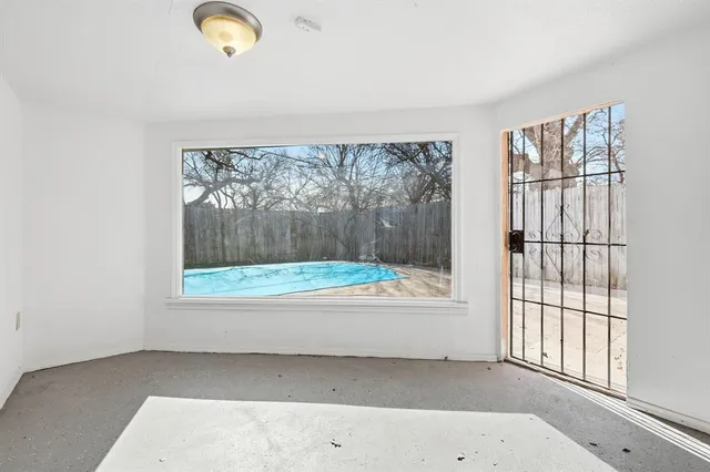 an empty room with windows