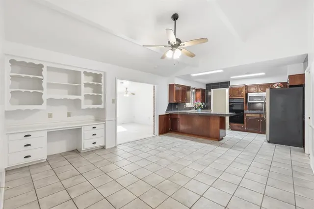 a view of kitchen with furniture and window