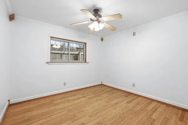 a bathroom with a sink vanity mirror and toilet