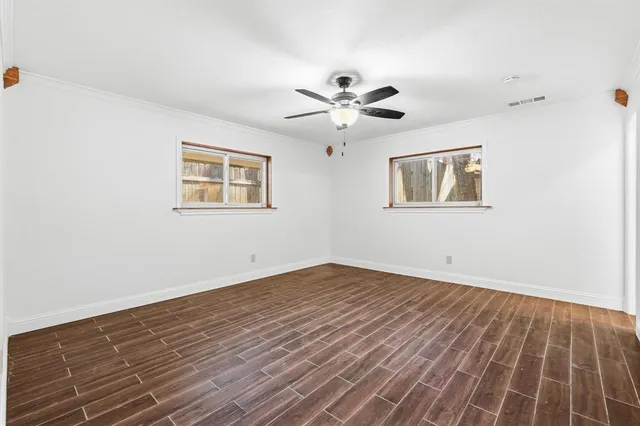 a bathroom with a granite countertop sink a mirror and a shower