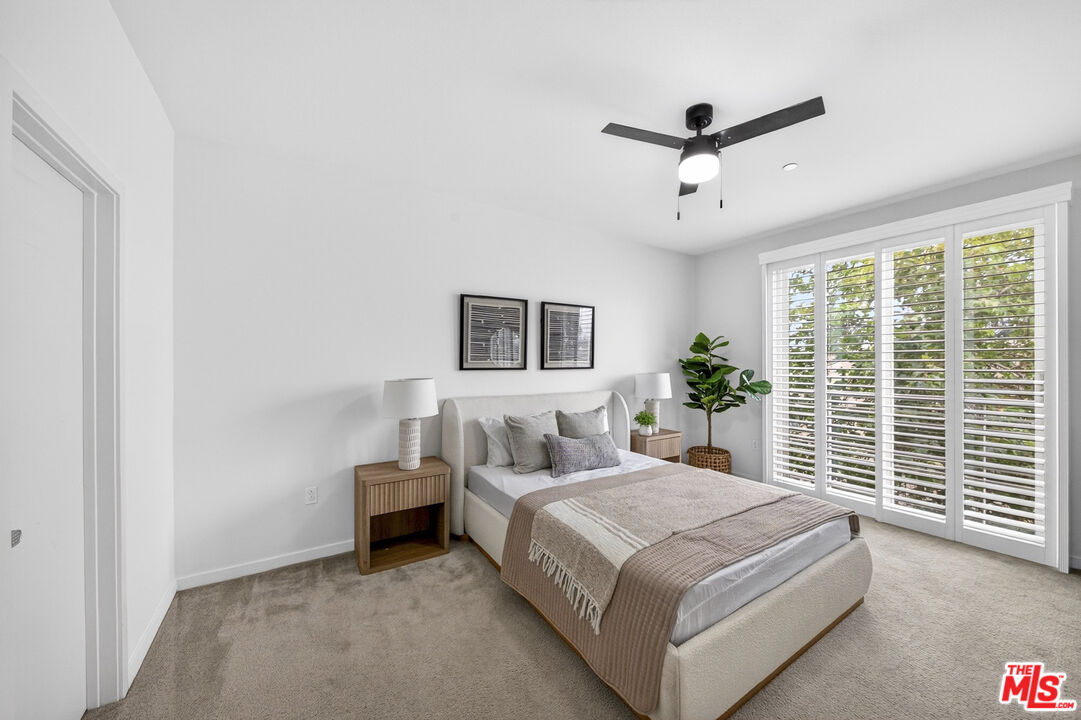 676 Colorado Circle Carson, CA 90745 - Photo 19 of 36 a bedroom with a large bed and a large window