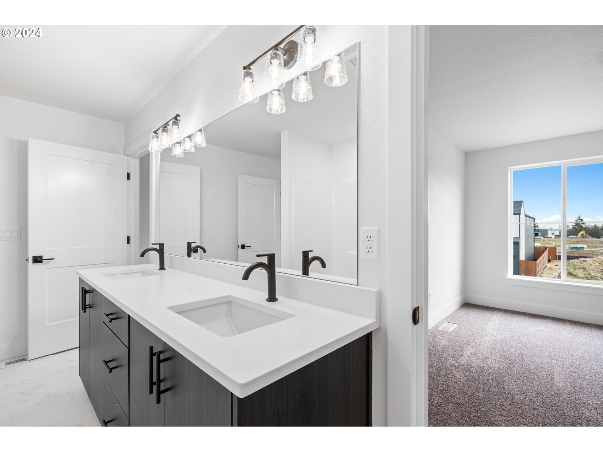 836 Northwest 175th Way Ridgefield, WA 98642 - Photo 11 of 21 a bathroom with a sink a mirror and a vanity