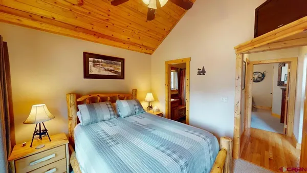 a bedroom with a bed and a lamp