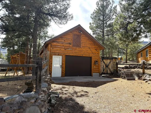 a front view of a house with yard