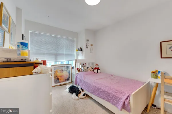 a bed room with a bed and a couch