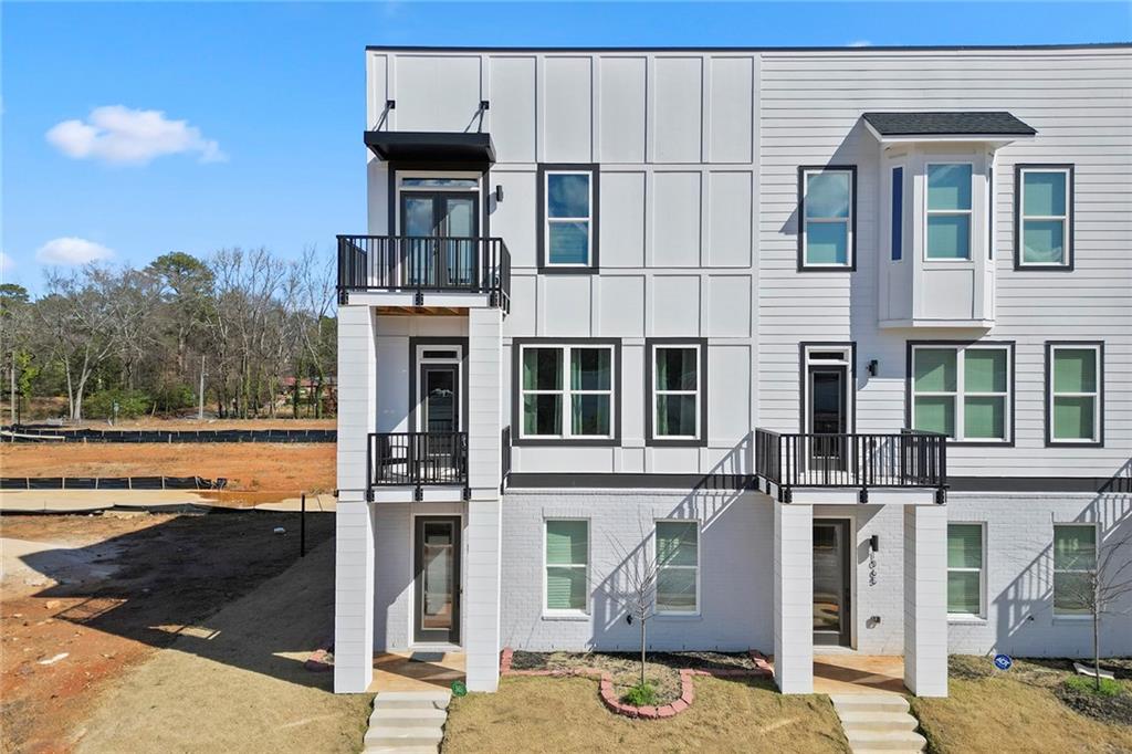 1072 Brookglynn Trace Decatur, GA 30032 - Photo 1 of 1 a front view of a house with a ocean view