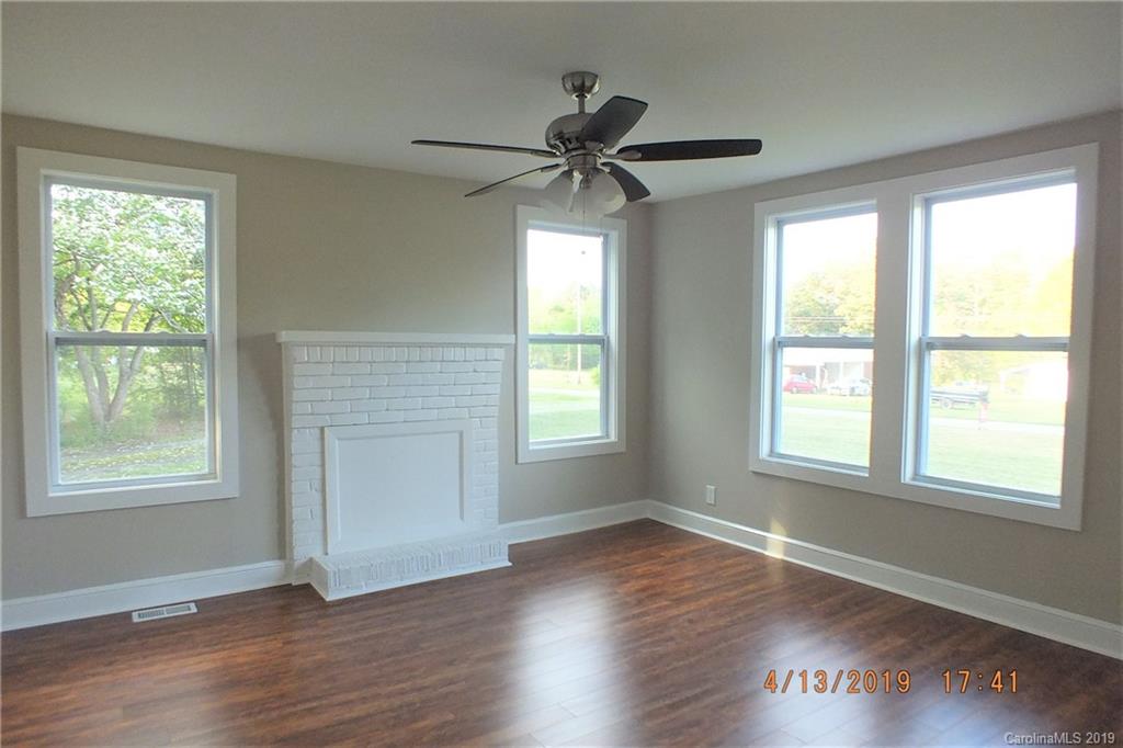 288 South Potter Road Lancaster, SC 29720 - Photo 2 of 24 a view of an empty room with wooden floor and a window