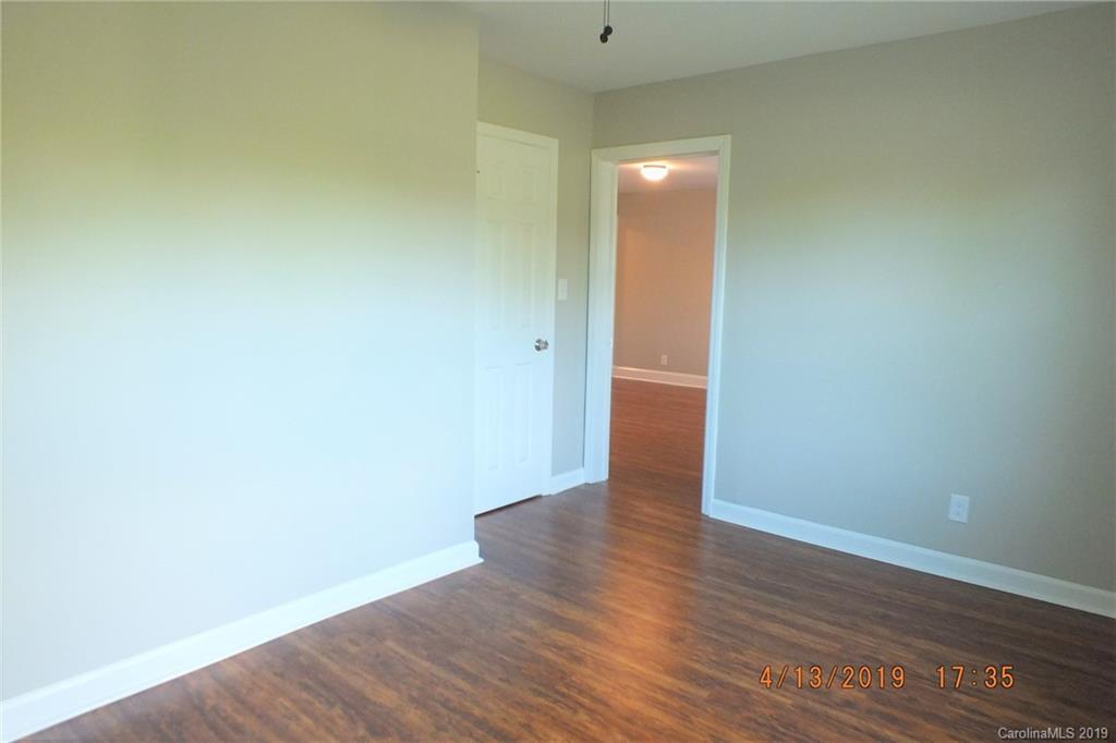 288 South Potter Road Lancaster, SC 29720 - Photo 11 of 24 a view of an empty room with wooden floor