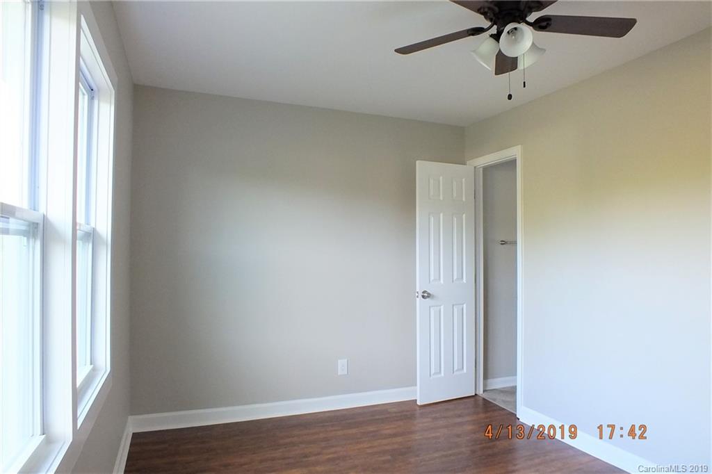 288 South Potter Road Lancaster, SC 29720 - Photo 16 of 24 an empty room with wooden floor fan and windows